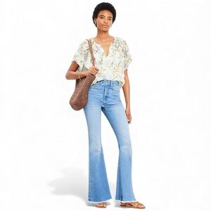 The Loft Frayed High Rise Slim Flare Jeans in Classic Mid Wash. Women’s size 12.